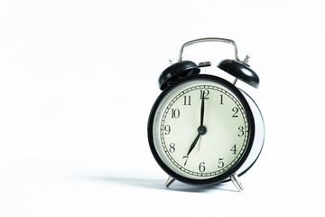 Black alarm clock isolated on white