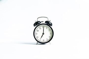 Black alarm clock isolated on white