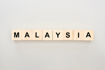 top view of wooden blocks with Malaysia lettering on white background