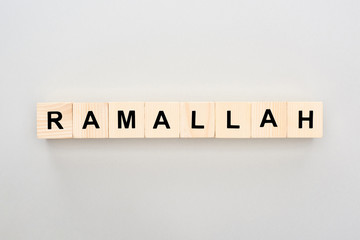 top view of wooden blocks with Ramallah lettering on white background
