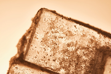 textured transparent ice cube on illuminated background
