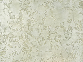 Texture decorative green plaster imitating the old peeling wall.