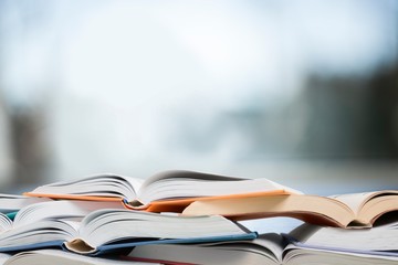 Books collection in pile on  background.