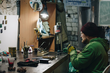 Jeweler working at workshop