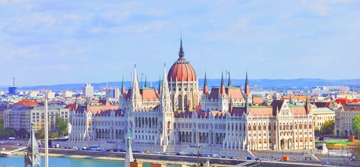 Fototapeta na wymiar A landscape view of Budapest city at daytime, the Hungarian parliament building and other buildings along Danube river, Hungary. One of the most beautiful building in the Hungarian capital.