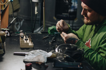 Jeweler working at workshop