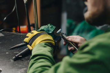 Jeweler polishing a silver ring