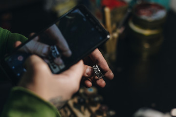 Fototapeta na wymiar Jeweler taking picture of a ring