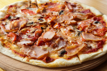 Tasty hot pizza on wooden table