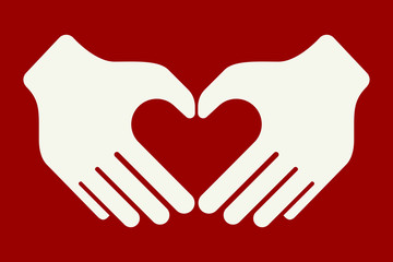 Hands forming a heart shape with their fiingers.