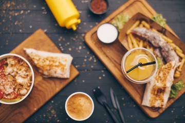 Fast food Food photo. Background. Eating. Wooden background. 