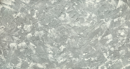 Panorama of gray-white concrete. Textural background in gray-white shades for design and decoration. Textured panorama in the form of gray and white spots, strokes, strokes.