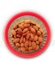 Close-up of almonds in bowl in white background