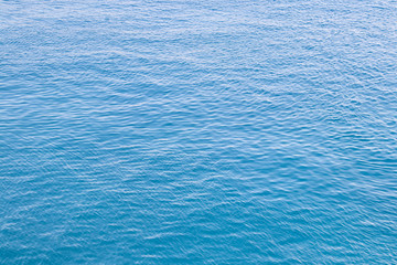 Background of abstract seawater in Italy. Azure color. Summer background.