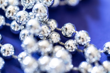close up of silver beads. christmas and holiday decoration concept