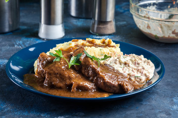 Stewed pork neck with potatoes and sauce