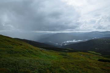 rain high in the mountains floods half the panorama of the mountains