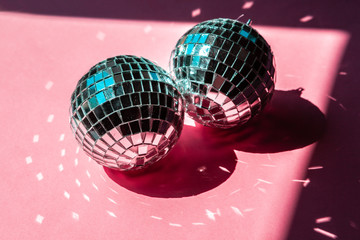 disco ball bauble on pink background.  party concept
