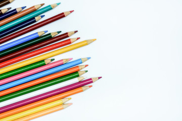 colored pencils on the white background. Place for text.