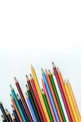 colored pencils on the white background. Place for text.