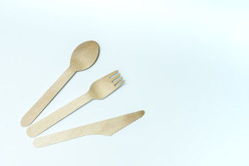 Disposable tableware from natural materials, wooden spoon, fork, knife, eco-friendly. Place for text