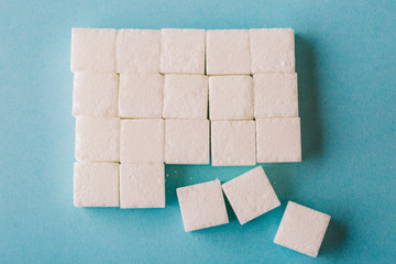 Top view of sugar cube on blue background