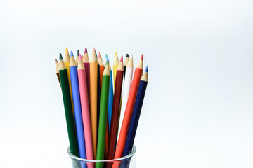 colored pencils on the white background. Place for text.