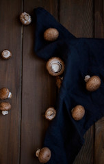 Brown champignons on rustic background