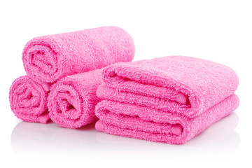 Obraz na płótnie Canvas Clean pink towels, isolated on white background