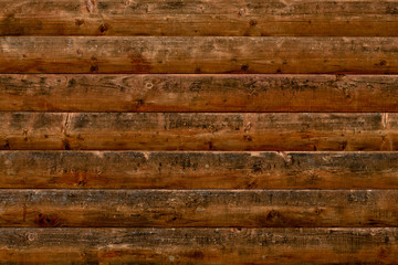 Abstract pattern with dirty dark decrepit shabby wood. Vintage table, desk surface. Blank space. Natural color. Weathered timber. Wooden background. Black fence in vintage style. Brown old wood 