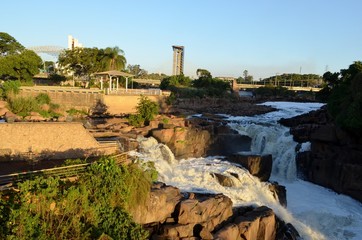 Polluted Tiete river in Salto city, São Paulo, Brazil - Waterfall turistc complex park