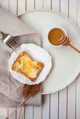 Top view of morning breakfast with toast and honey