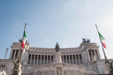 Obraz premium Italian flag in front of Altare della Patria Vittorio Emanuele II Monument Rome Italy