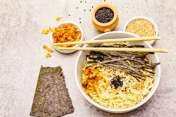 Noodles with seaweed, tuna flakes and sesame seeds