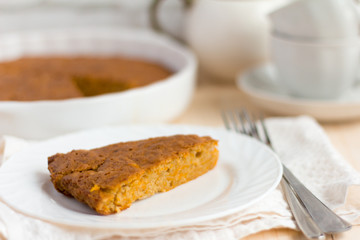 delicious fresh homemade pumpkin pie and tea utensils on the table