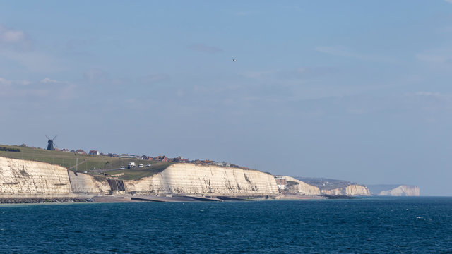 view from brighton marina of cliffs and rottingdean