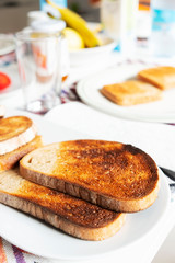 toasts on a table set for breakfast or dinner.