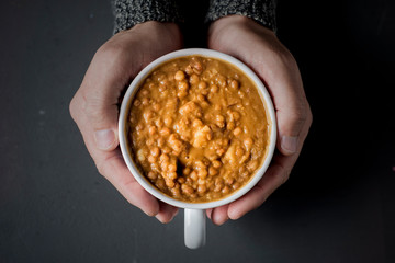 man with a bowl of lentil soup