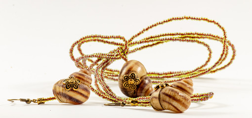 Seashell pendant and earrings on chain of beads