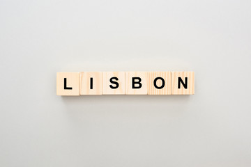 top view of wooden blocks with Lisbon lettering on grey background