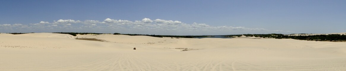 Panoramic view dunes and small car in Fortaleza City, Ceará, Brazil