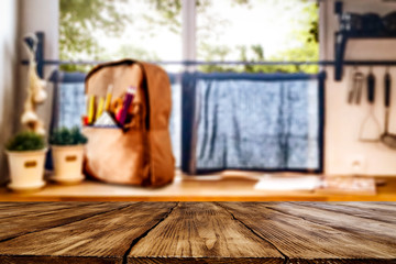 Desk of free space and school backpack on widnow sill 