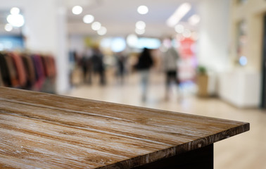 Empty dark wooden table in front of abstract blurred bokeh background of restaurant . can be used for display or montage your products.Mock up for space.