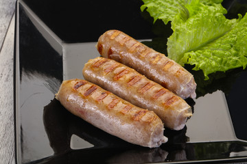 Grilled sausages served mushrooms and cabbage
