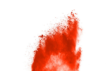 abstract orange powder splatted background,Freeze motion of color powder exploding/throwing color...