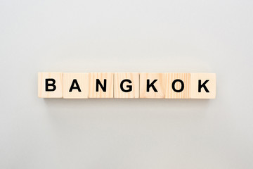 top view of wooden blocks with Bangkok lettering on grey background