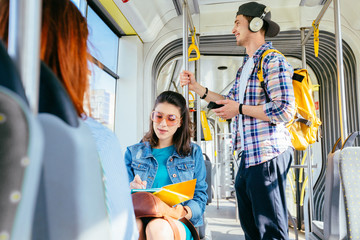 young woman taking bus to work. Urban public transportation concept