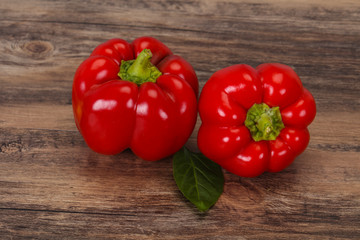 Ripe Red bell pepper over wooden