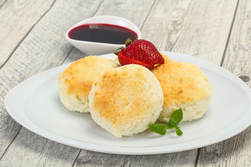 Curd pancakes with jam and stravberry