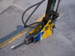 Road works building site excavator and worker